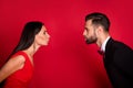 Photo of charming lady neat guy closing distance kiss lips closed eyes isolated on red color background Royalty Free Stock Photo