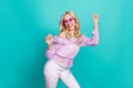 Photo of charming lucky lady wear violet blouse pink glasses dancing rising fists isolated turquoise color background