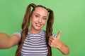 Photo of charming nice cool young lady hold take selfie camera make thumb up isolated on green color background