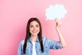 Photo of charming nice happy young woman hold hand cloud think isolated on pastel pink color background