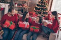 Photo of charming pretty mom dad sister brother smiling getting noel gifts embracing talking indoors house home room