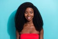 Photo of charming shiny dark skin lady wear red crop top smiling isolated blue color background