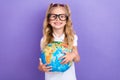 Photo of charming small girl tails eyewear hug globe earth school shopping dressed stylish white look on violet