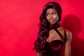 Photo of charming stunning afro american young woman look empty space glamour lady on red color background