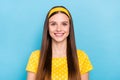 Photo of charming sweet young lady dressed yellow clothes smiling isolated blue color background