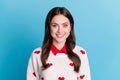 Photo of charming sweet young woman dressed hearts print pullover smiling isolated blue color background