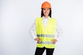 Photo of charming worker lady hands hips beaming smile wear helmet shirt vest isolated white color background Royalty Free Stock Photo