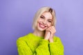 Photo of cheerful adorable lady wear green pullover smiling arms cheek isolated purple color background