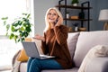 Photo of cheerful adorable senior woman sitting sofa speaking with customer client discussing project vacancy indoors Royalty Free Stock Photo