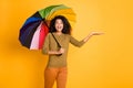 Photo of cheerful brown positive cute nice charming pretty sweet girl holding object with hands while catching raindrops