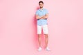 Photo of cheerful business man folded hands wear blue shirt shorts shoes isolated on pink color background