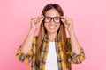 Photo of cheerful charming happy mature woman wear glasses eyesight oculist on pink color background