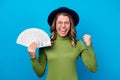 Photo of cheerful crazy curly lady hold fan dollar bucks rich person freelance salary successful business woman raise Royalty Free Stock Photo