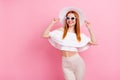Photo of cheerful dreamy young woman look empty space good mood summer isolated on pink color background