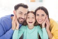 Photo of cheerful family happy positive smile hand touch cheeks mommy daddy daughter cute enjoy friendship indoors