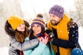 Photo of cheerful family happy positive smile hug cuddle embrace look each other fly air snow walk park weekend