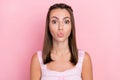 Photo of cheerful flirty young charming woman send air kiss good mood lady isolated on pastel pink color background