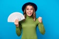 Photo of cheerful funny curly lady hold fan dollar bucks rich person freelance salary successful business woman raise Royalty Free Stock Photo