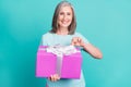 Photo of cheerful good mood attractive grandmother open birthday present gift box isolated on turquoise color background