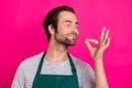 Photo of cheerful gourmet man enjoy tasty dinner meal wear apron t-shirt isolated pink color background