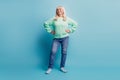 Photo of cheerful granny put hands on waist over blue pastel background