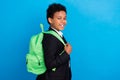 Photo of cheerful happy positive small boy wear backpack good mood isolated on pastel blue color background