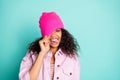 Photo of cheerful impolite rude girl sticking her tongue out in striped t-shirt jacket pink showing pulling her cap upon