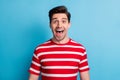 Photo of cheerful impressed funny guy dressed red clothes open mouth isolated blue color background