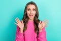Photo of cheerful impressed lady dressed knitted pullover rising arms open mouth isolated teal color background