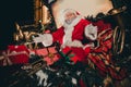 Photo of cheerful jolly grandpa sit decorated sleigh open hands arms enjoying magic time moments winter season snowy Royalty Free Stock Photo