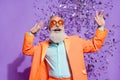 Photo of cheerful joyful cool old man confetti fall wear sunglass clubber isolated on purple color background Royalty Free Stock Photo