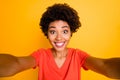 Photo of cheerful nice attractive black girlfriend trendy wearing t-shirt smiling toothily taking selfie over