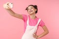 Photo of cheerful nice girl taking selfie on cellphone and smiling