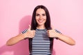 Photo of cheerful nice young woman make thumbs up good mood smile isolated on pastel pink color background Royalty Free Stock Photo