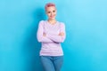 Photo of cheerful office manager lady pink dyed hair hold arms crossed wear casual shirt jeans isolated blue color Royalty Free Stock Photo