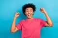 Photo of cheerful overjoyed man wear pink stylish clothes rise fists celebrate suceess isolated on blue color background