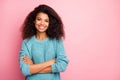 Photo of cheerful positive cute pretty nice woman in blue sweater smiling toothily expressing positive emotions on face Royalty Free Stock Photo