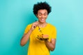 Photo of cheerful satisfied person hold fork eat potato sausage plate isolated on teal color background
