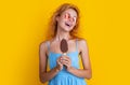 photo of cheerful woman with icecream at summer. woman with icecream on yellow.