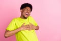 Photo of cheerful young afro american joyful man laugh good mood enjoy isolated on pink color background Royalty Free Stock Photo