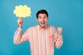 Photo of cheerful young amazed happy man winner hold hand cloud speech isolated on blue color background