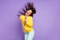 Photo of cheerful young positive woman point finger you fly hair mic singer karaoke isolated on purple color background Royalty Free Stock Photo