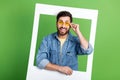 Photo of cheerfulexcited guy wear denim jacket tacking photo isolated green color background