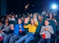 Photo of children sitting on first cinema row.