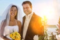 Portrait of chinese bride with caucasian groom with lens flare