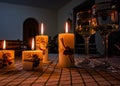 Christmas candles with Santa ornament and white wine glass bowls on the side