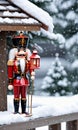 Photo Of Christmas Nutcracker Holding A Lantern Beside A Snow-Covered Birdhous. Generative AI
