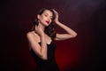 Photo of classy gorgeous lady touch adjust haircut before evening ceremony event over dark background