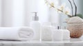 Photo of a clean and organized bathroom counter with white towels and soap dispensers