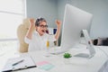 Photo of clever lucky lady expert wear white shirt rising fists successful achievment modern device indoors workplace